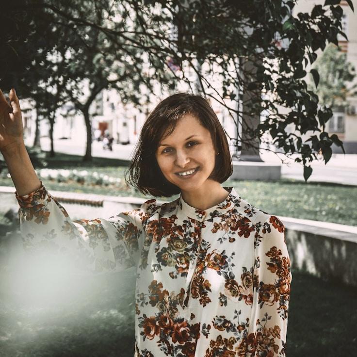 Kaveri Mehta, Lead Design Curator at ValleyDockMosaic, reviewing corporate floral arrangements